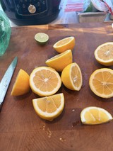 Freshly Cut Citrus Fruits on Wooden Cutting Board