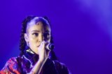 FKA twigs Stunning Close-Up Portrait Direct Gaze Baby Hairs Swirls Cat-Eye Makeup Multiple Earrings Septum Ring Red Lipstick Black Choker Braided Ponytails Kimono Purple Blue Lighting