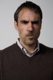 Serious Man in a Knit Sweater