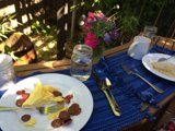 Blue Tablecloth and Flower Arrangement