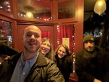 Friends Gathering at Cozy Restaurant Entrance
