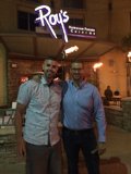Two Men Enjoy a Night Out at the Local Restaurant