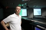 Standing Tall in Front of Large Screen