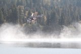 Helicopter and Fire Truck Over Lake