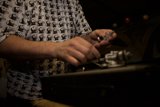 Repairing the Beat: A Man Fixes a Record Player