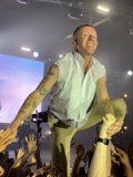 Tattooed Macklemore Performing on Stage