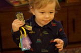 Toddler Playing with Toy Phone on Christmas