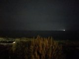 A Glowing Night Sky Above the Ocean
