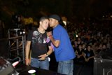 Two Men Grooving to Dynamite MC's Performance