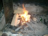Flames Dance in a Wood Fire Pit