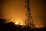 Flames Engulf Power Lines During Wildfire