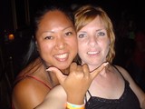 Two Friends Smiling at a Nightclub Party