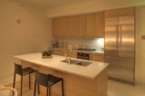 Modern Kitchen with Wooden Cabinets and Stainless Steel Appliances