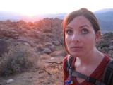 Hiker Pauses at Sunset on Rocky Desert Trail