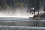 Helicopter Spraying Water on Lake