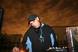 DJ S Entertains the Crowd in a Classic Baseball Cap