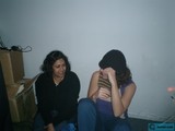 Two Women Sitting with Cardboard Boxes