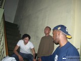 Three Men on Stairs with Cell Phone