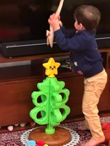 Toddler Playing Interactive Christmas Tree Game at Home