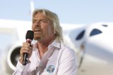 Richard Branson addresses the crowd in front of White Knight Two