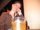 Smiling Woman Relaxing with Drinks After Hike
