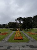 The Majestic Flower Bed with a Centerpiece Statue
