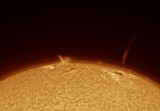 Solar Surge Prominence and Jet Over Sun's Limb