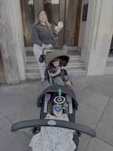 Mother with Baby Stroller on City Steps