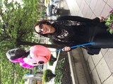 Joyful Woman with Minnie Mouse Balloons on City Street