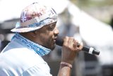 The Entertainer with a Hat and Microphone