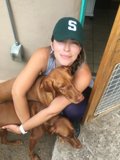 Woman Hugging Her Canine Companions in Santa Fe