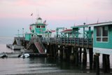 Waterfront Dock with Boats and Flags