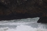 Waves Crashing Through Sea Cave Rocky Cove