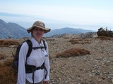 Hiker Pauses at Summit of Mount Baldy
