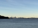 Majestic Cityscape and Tranquil Lake at Point Tiberon Shoreline