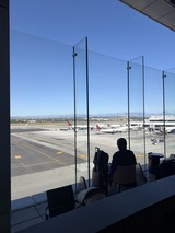 Silhouette Waiting at Airport Gate Overlooking Tarmac