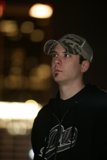 Black Jacketed Man with Baseball Cap