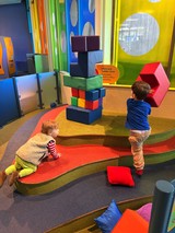 Children Playing with Giant Building Blocks in Museum Play Area