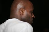 MC Q: Shaved Head Portrait