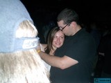 An Endearing Hug at a Nighttime Party