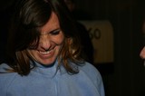 Candid Smile: Woman in Blue Fleece Looking Down