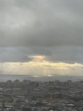 Glorious City Sunrise through Cumulus Clouds