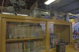 Wooden Bookcase and Ceiling Fan