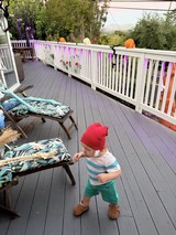 Toddler Dancing on Foggy Morning Deck