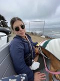 Woman and Dog Enjoying the Ocean View
