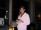 Woman in Pink Robe at Home Tech Setup