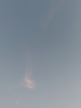 Faint Moon Through Heavy Overcast Sky