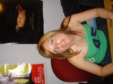 Young Woman Posing Sideways with Lord of the Rings Poster