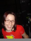 Red Shirted Woman with Glasses