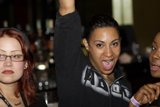 Three Women Strike a Pose in Urban Nightlife Scene
